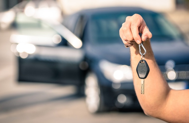 Hand holding car keys