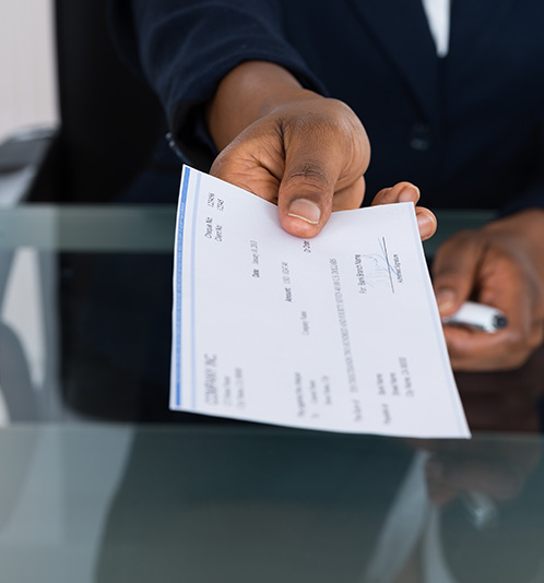 Hand holding a check