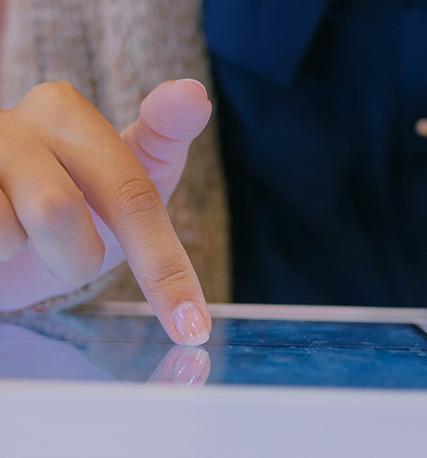 Finger touching a screen